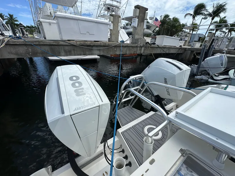 Slide: The Image of 2020 World Cat 325 CC with twin 300 HP outboard engines docked at marina. - 6