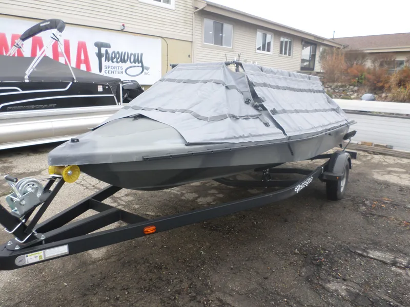 Slide: The Image of 2024 Bankes Freedom 17 boat on trailer with protective cover at dealership. - 4