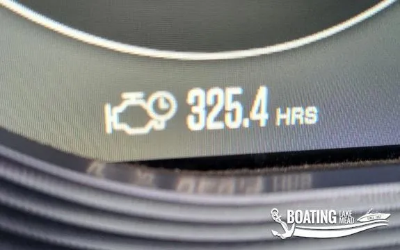 Slide: The Image of 2021 MasterCraft X26 engine hours display showing 325.4 hours. - 36