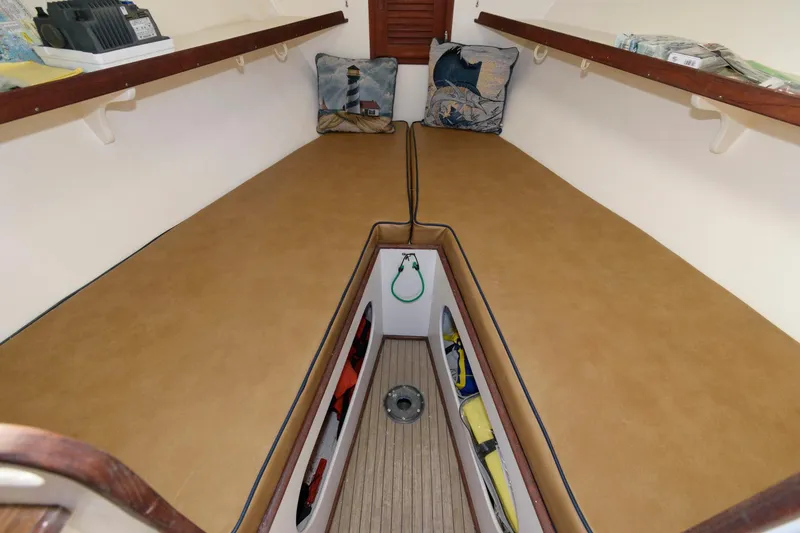 Slide: The Image of Interior cabin of 1983 Dyer 29 Downeast Express with cushions and storage. - 18