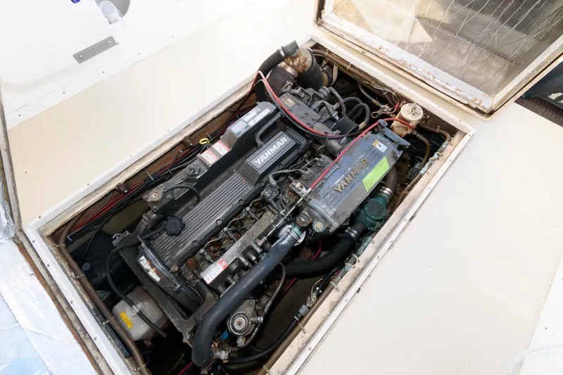 Slide: The Image of 1983 Dyer 29 Downeast Express engine compartment with Yanmar marine engine. - 20
