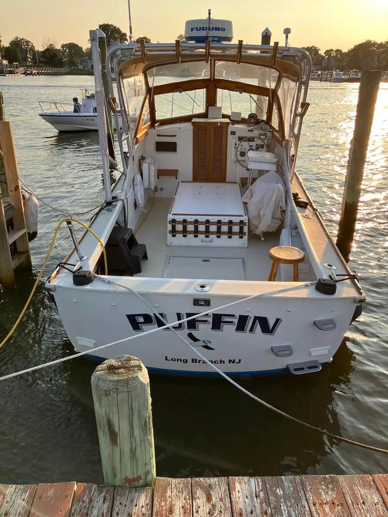 Slide: The Image of 1983 Dyer 29 Downeast Express boat docked in Long Beach, NJ marina. - 3