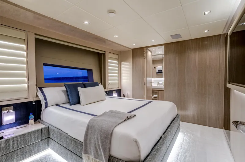 Slide: The Image of Luxurious 2023 Mangusta Gransport yacht bedroom with modern design and ambient lighting. - 23