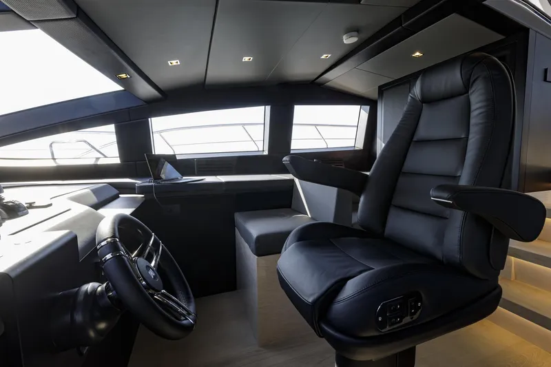 Slide: The Image of Luxurious interior of 2023 Mangusta Gransport yacht with sleek black captain's chair. - 29