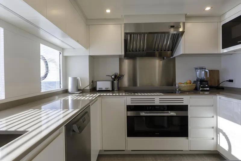 Slide: The Image of Modern kitchen interior on 2023 Mangusta Gransport yacht, featuring sleek appliances and ample counter space. - 30