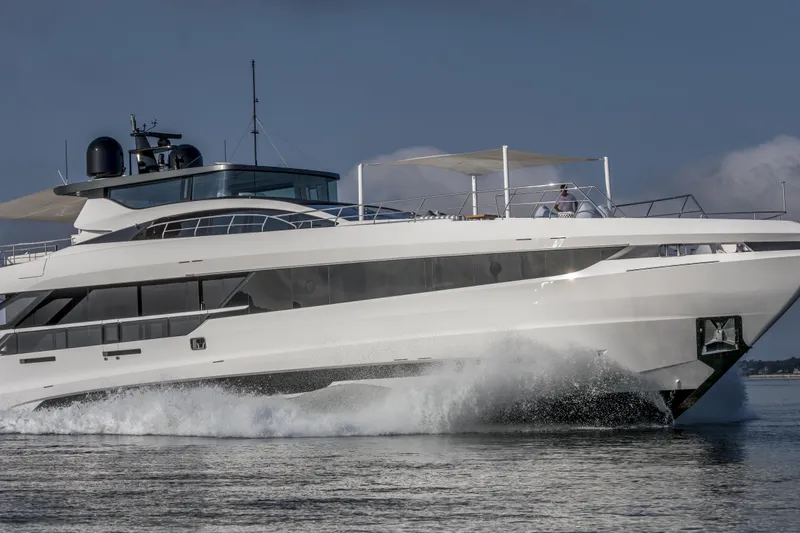 Slide: The Image of 2023 Mangusta Gransport yacht cruising on open water. - 34