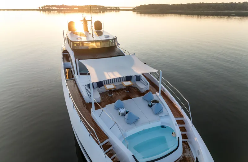 Slide: The Image of Luxurious 2023 Mangusta Gransport yacht with sun deck and pool at sunset. - 5