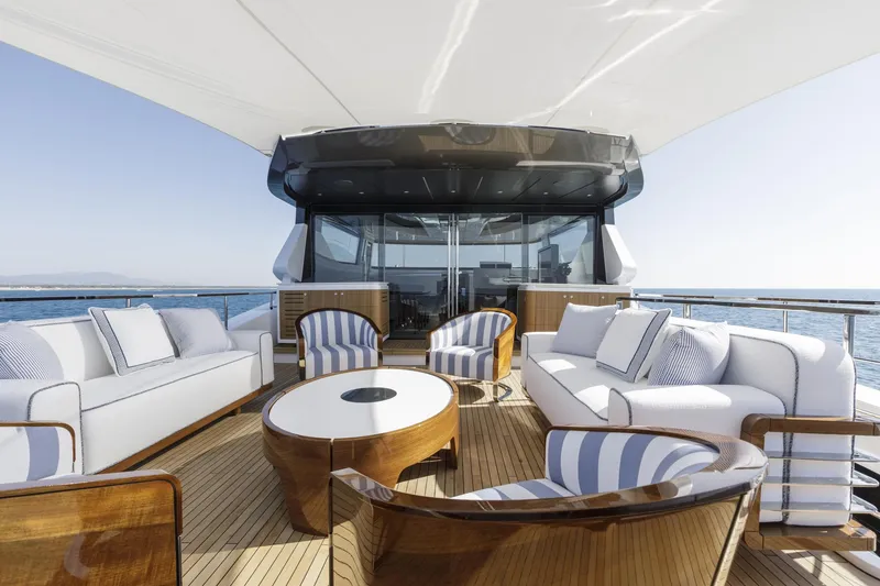 Slide: The Image of Luxurious 2023 Mangusta Gransport yacht deck with elegant seating and ocean view. - 7