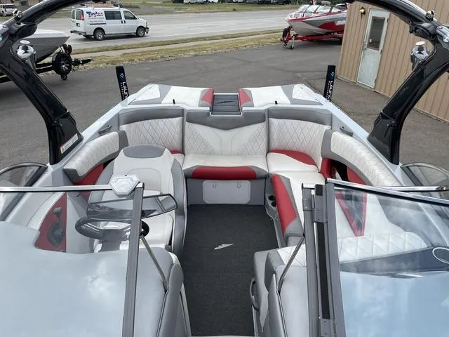 Slide: The Image of 2015 Tigé Z1 boat interior with red and white seating, sleek design. - 10