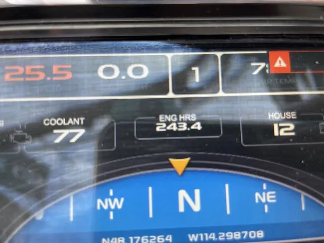 Slide: The Image of Dashboard of 2015 Tigé Z1 boat showing engine hours and navigation details. - 12