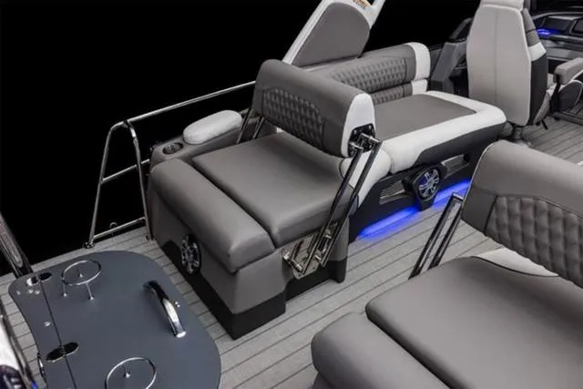 Slide: The Image of Luxurious seating on 2025 Avalon Excalibur LTD Quad Lounge boat with modern design and ambient lighting. - 2