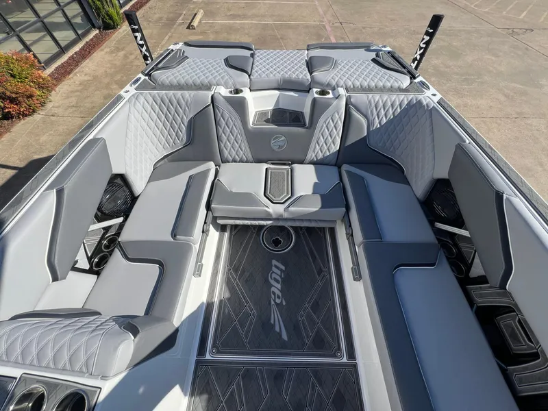 Slide: The Image of 2025 Tigé 24RZX boat interior with luxurious gray seating and diamond stitching. - 7