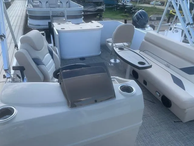 Slide: The Image of 2023 SunCatcher Select 18F pontoon boat interior with seating and console. - 14