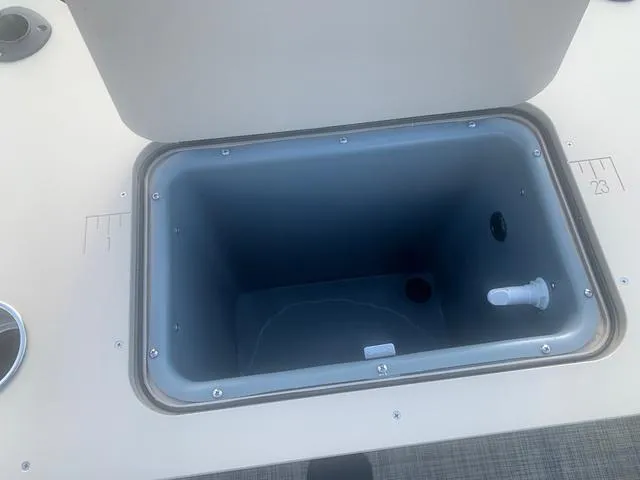 Slide: The Image of Open storage compartment on 2023 SunCatcher Select 18F boat. - 6