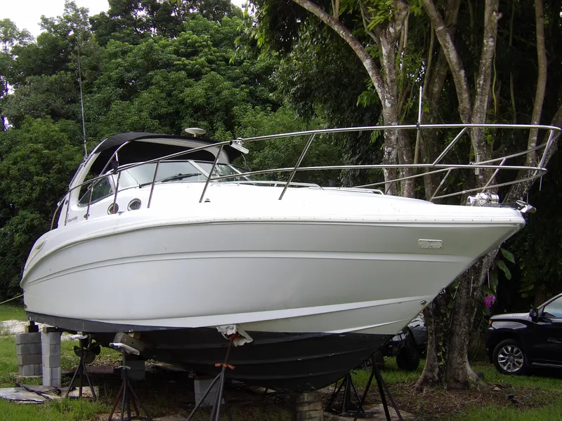 Slide: The Image of 2005 Sea Ray 360 Sundancer yacht on stands, surrounded by trees. - 0