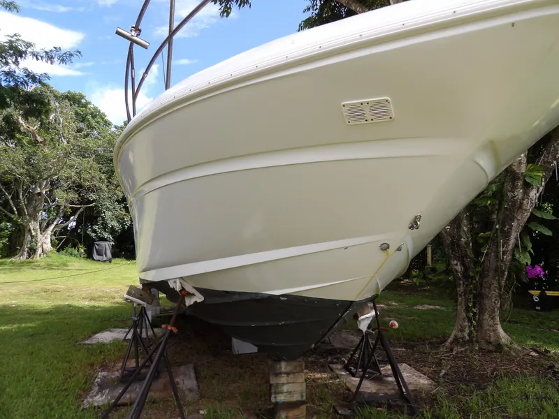 Slide: The Image of 2005 Sea Ray 360 Sundancer boat on stands in a grassy area. - 12