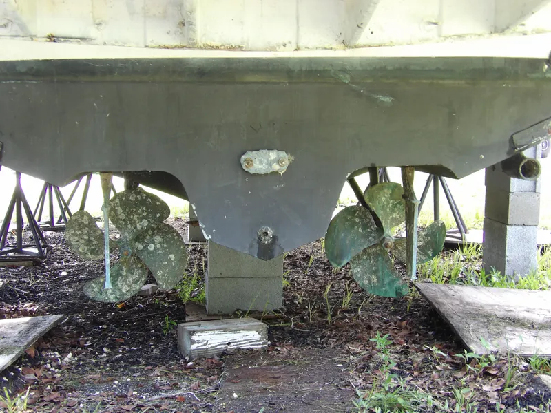 Slide: The Image of 2005 Sea Ray 360 Sundancer propellers and hull on dry land. - 17