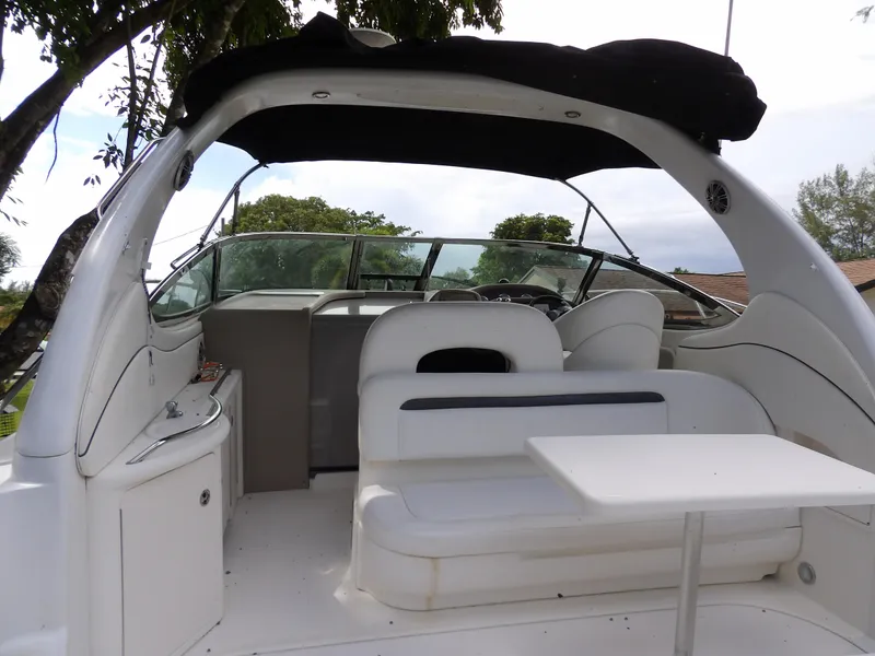 Slide: The Image of 2005 Sea Ray 360 Sundancer interior with seating and table under canopy. - 36