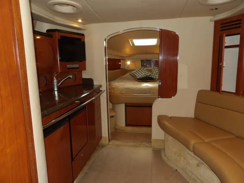 Slide: The Image of Interior of 2005 Sea Ray 360 Sundancer yacht with kitchen and cozy sleeping area. - 41