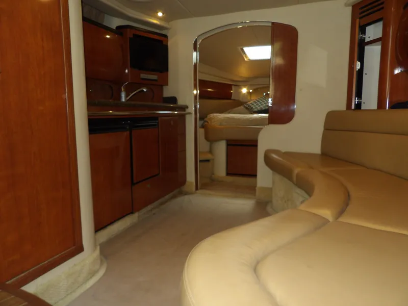 Slide: The Image of Interior of 2005 Sea Ray 360 Sundancer yacht with kitchen and seating area. - 42