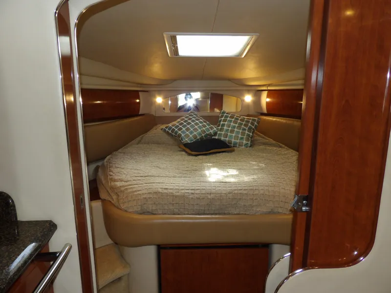 Slide: The Image of Luxurious cabin interior of 2005 Sea Ray 360 Sundancer yacht with cozy bedding. - 44