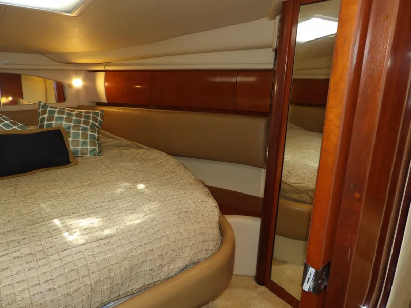 Slide: The Image of Luxurious cabin interior of 2005 Sea Ray 360 Sundancer yacht with cozy bedding. - 47