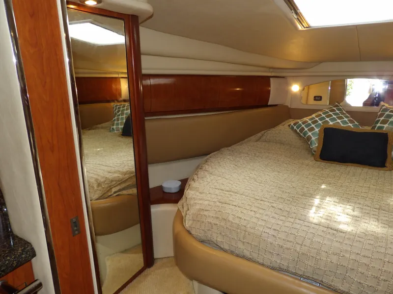 Slide: The Image of Luxurious cabin interior of 2005 Sea Ray 360 Sundancer yacht with cozy bedding. - 48