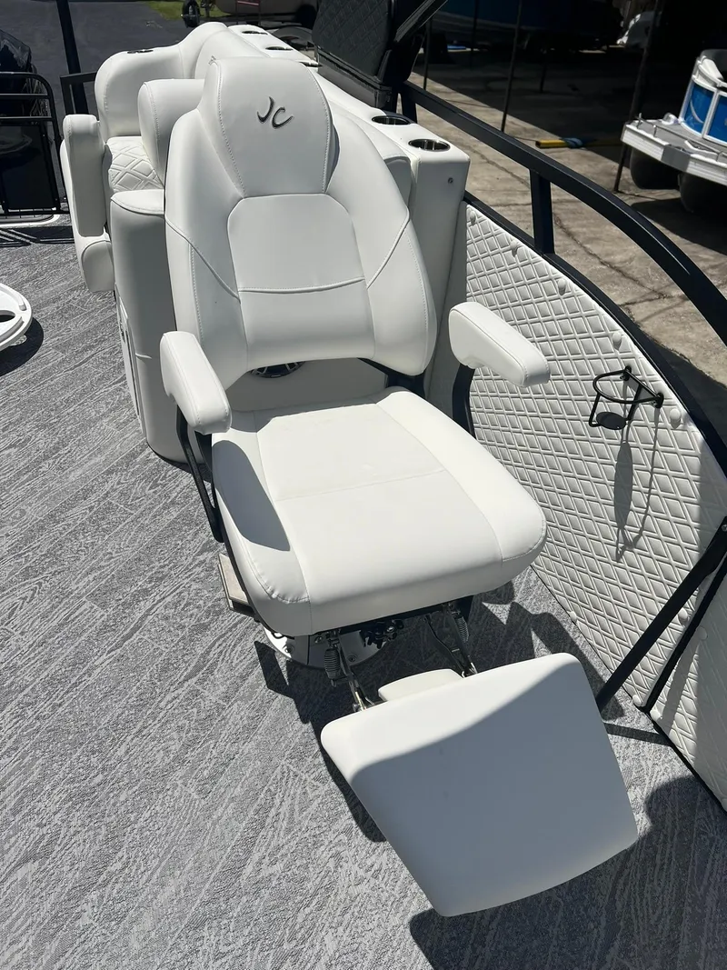 Slide: The Image of Luxury seating on 2025 JC 26 SportToon TT DSL boat, featuring white upholstery and ergonomic design. - 10