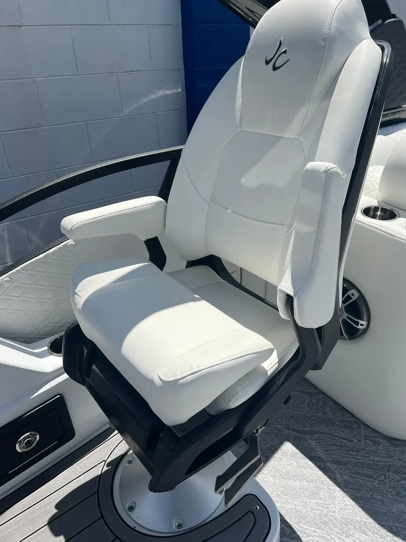 Slide: The Image of White captain's chair on 2025 JC 26 SportToon TT DSL boat. - 12