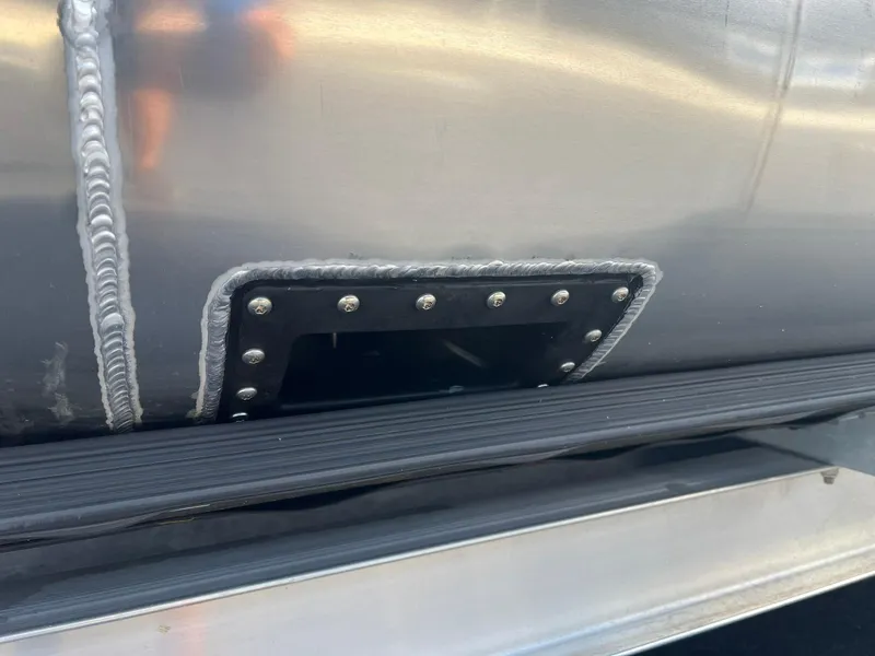 Slide: The Image of Close-up of 2025 JC 26 SportToon TT DSL boat hull detail with welded joint. - 2