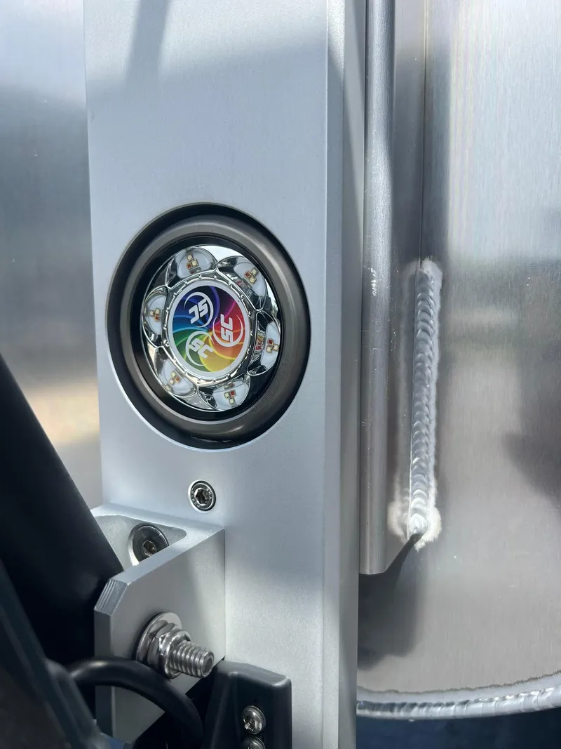 Slide: The Image of Close-up of 2025 JC 26 SportToon TT DSL boat detail with colorful LED light. - 23