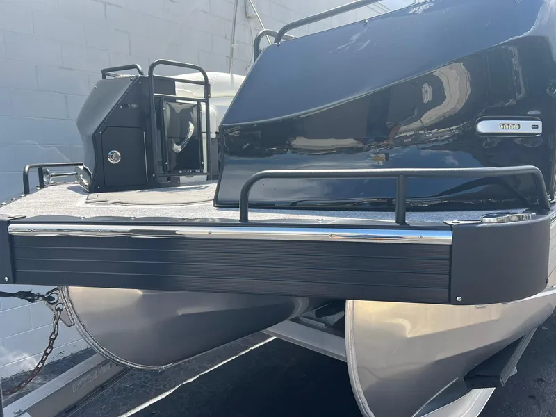 Slide: The Image of 2025 JC 26 SportToon TT DSL pontoon boat, sleek black design, modern features. - 24