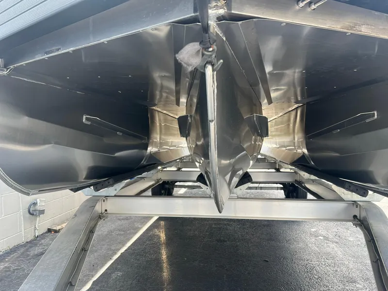 Slide: The Image of 2025 JC 26 SportToon TT DSL pontoon boat underside view on trailer. - 25