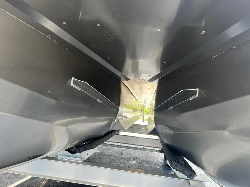 Slide: The Image of Underside view of 2025 JC 26 SportToon TT DSL pontoon boat. - 26