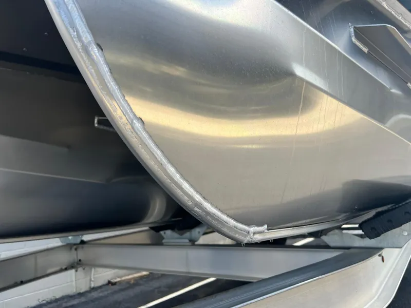 Slide: The Image of Close-up of 2025 JC 26 SportToon TT DSL pontoon boat hull. - 27