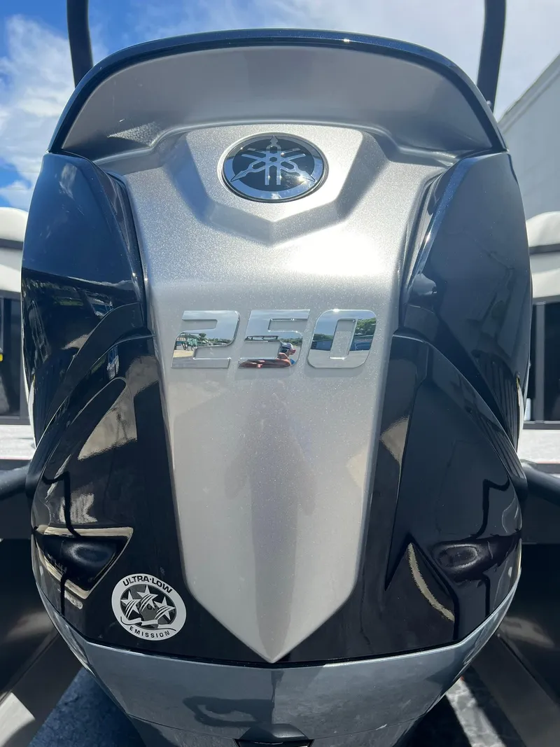 Slide: The Image of Close-up of a 2025 JC 26 SportToon TT DSL boat engine, featuring a 250 horsepower label. - 30