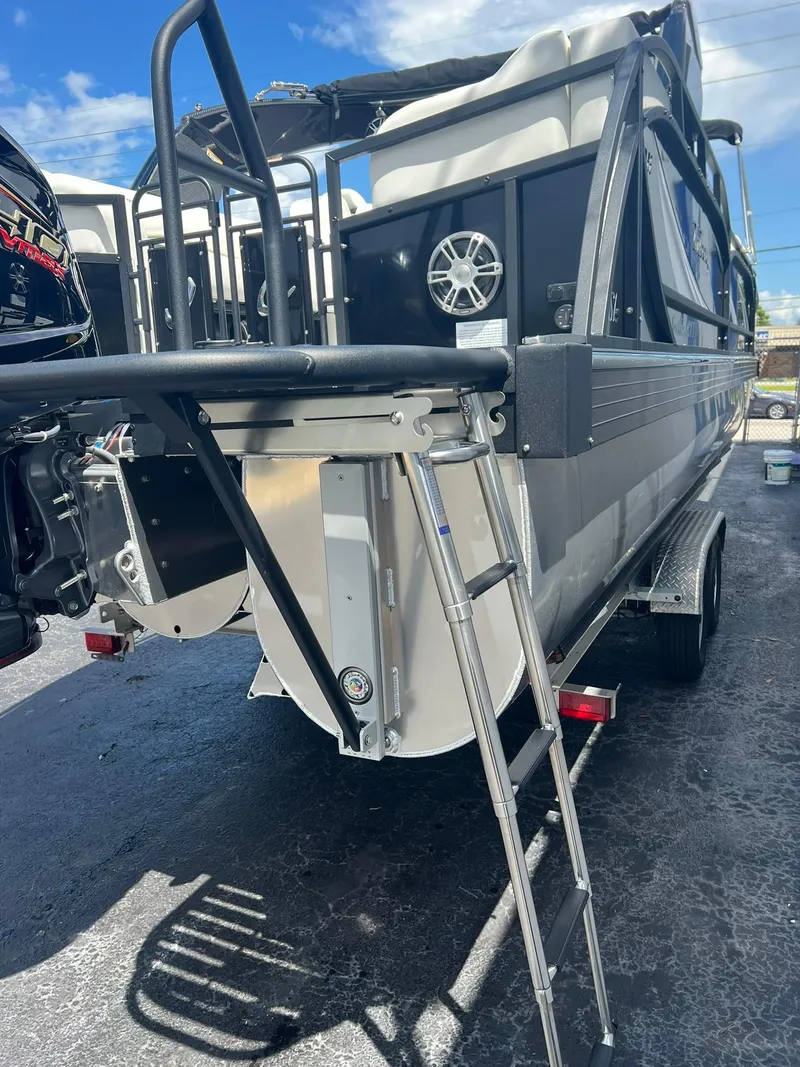 Slide: The Image of 2025 JC 26 SportToon TT DSL pontoon boat with ladder and motor, rear view. - 5