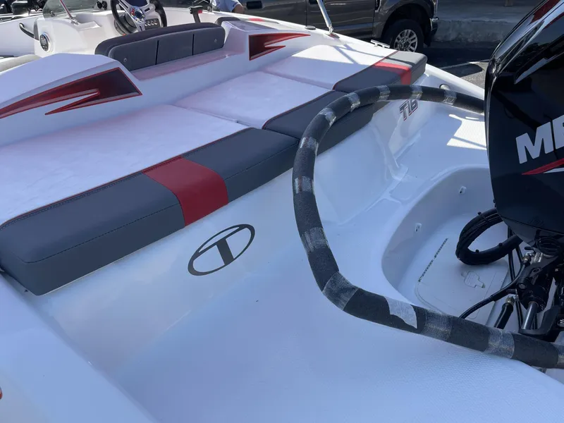 Slide: The Image of 2024 Tahoe T16 boat with red and gray seating, featuring a Mercury outboard motor. - 4