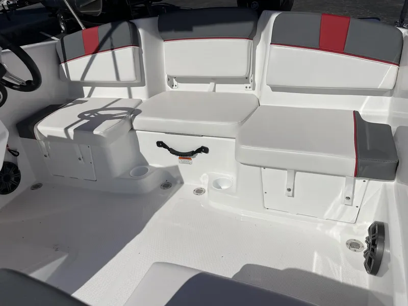 Slide: The Image of 2024 Tahoe T16 boat interior with white and gray seating, red accents. - 6