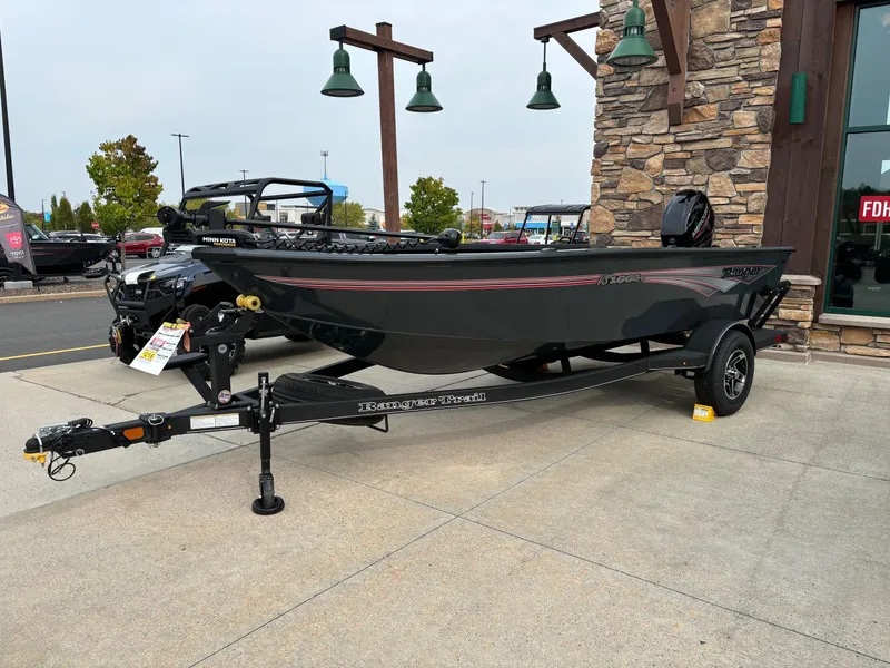 Slide: The Image of 2024 Ranger VS1665T fishing boat on display outside a store. - 1