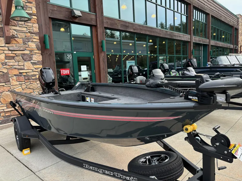 Slide: The Image of 2024 Ranger VS1665T fishing boat displayed outside a showroom. - 2