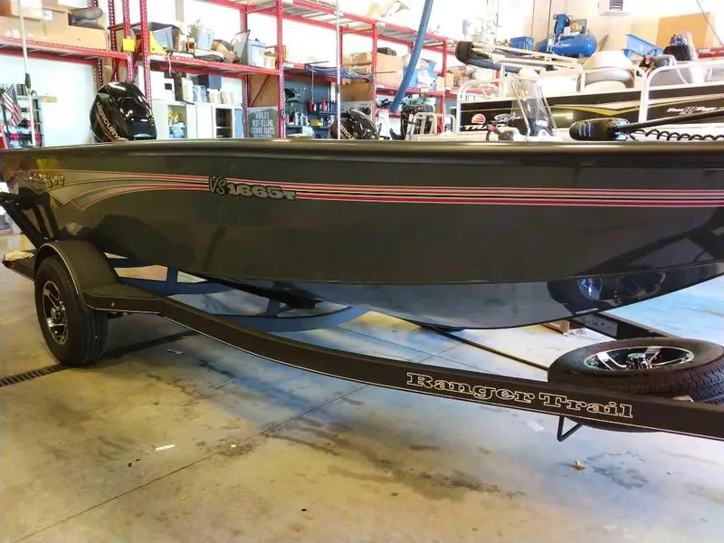 Slide: The Image of 2024 Ranger VS1665T fishing boat on trailer in a garage setting. - 3