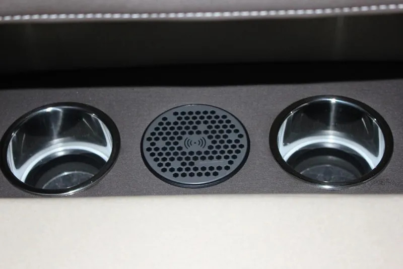 Slide: The Image of Vanderbilt 700SC 2022 interior cup holders and wireless charging pad. - 4