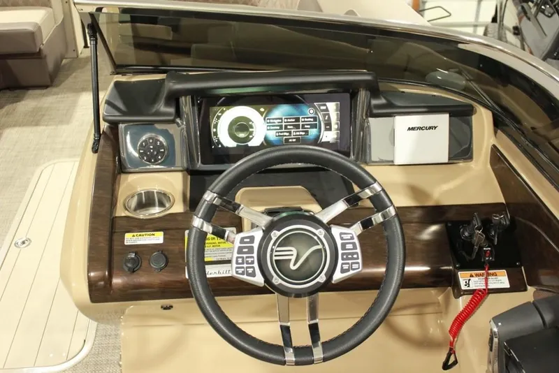 Slide: The Image of 2022 Vanderbilt 700SC boat dashboard with steering wheel and digital display. - 9
