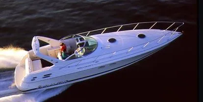 The Image of 2000 Wellcraft 45 Excalibur speedboat cruising on open water. - 0