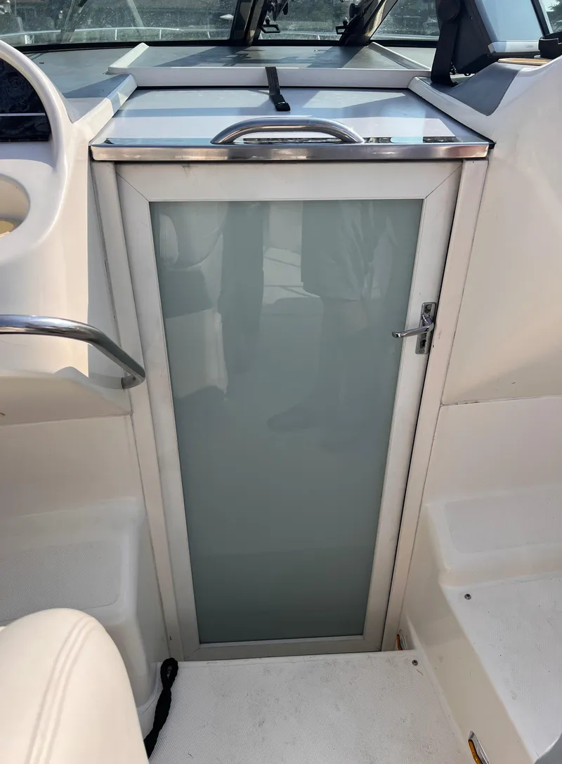 Slide: The Image of Cabin door of 2000 Wellcraft 45 Excalibur boat, sleek design. - 12