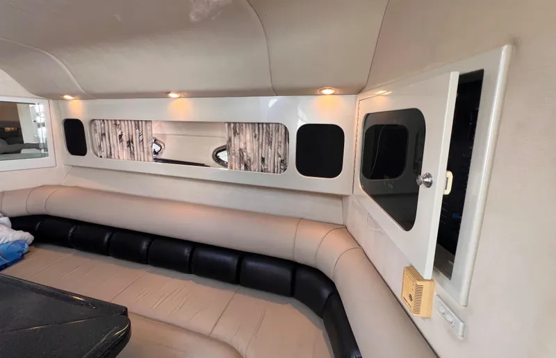 Slide: The Image of Interior of 2000 Wellcraft 45 Excalibur boat with beige seating and modern design. - 20