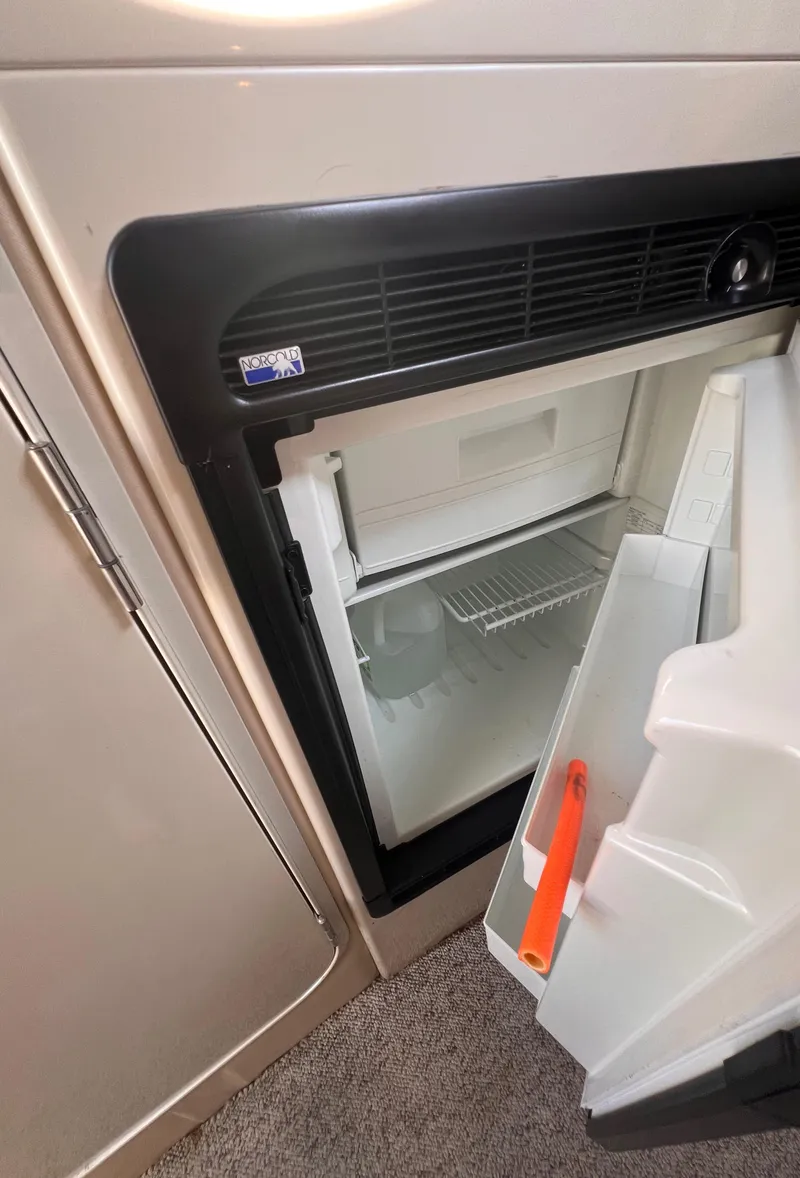 Slide: The Image of Compact refrigerator inside 2000 Wellcraft 45 Excalibur boat cabin. - 21