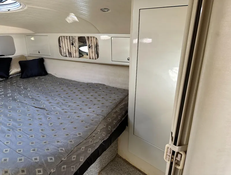 Slide: The Image of Interior cabin of 2000 Wellcraft 45 Excalibur with bed and storage cabinets. - 28