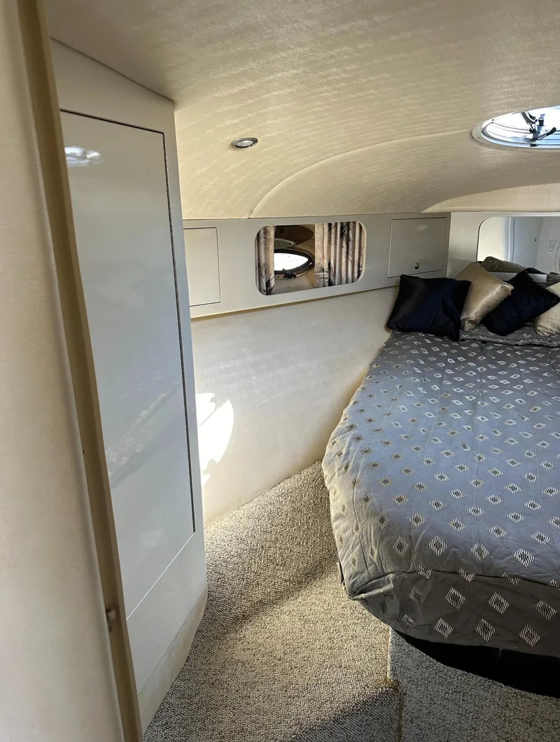 Slide: The Image of Interior of 2000 Wellcraft 45 Excalibur with cozy bed and modern design. - 29